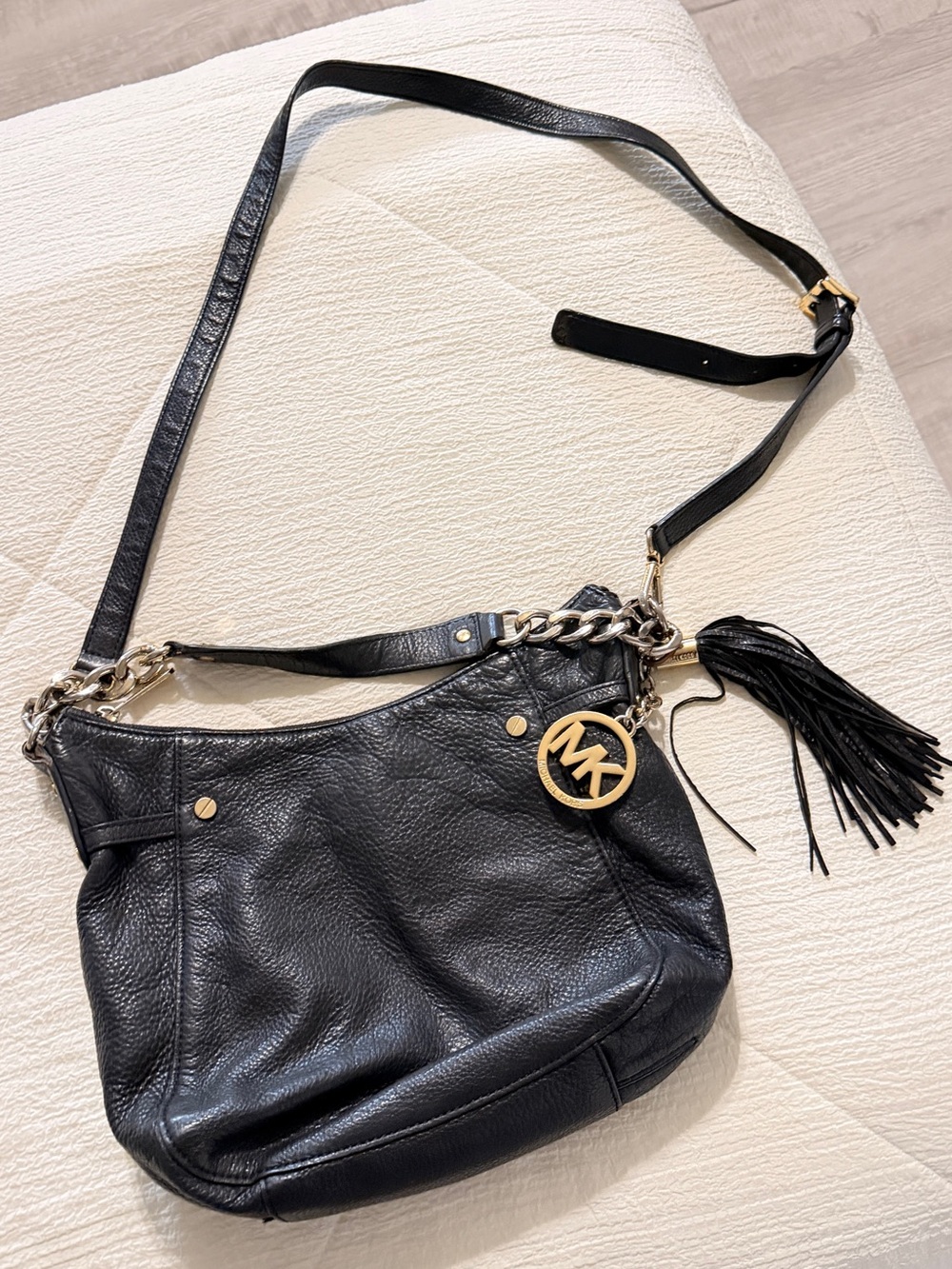 Michael Kors Black Leather Shoulder Bag with Gold Logo Charm and Tassel
